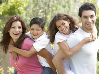 Family of four smiling